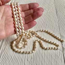 Strands of Freshwater Pearls in my hand. I used them to make my Freshwater Pearl Jewelry Collection with consists of a variety of Freshwater Pearl Necklaces, Pearl Bracelets and Freshwater Pearl Earrings.