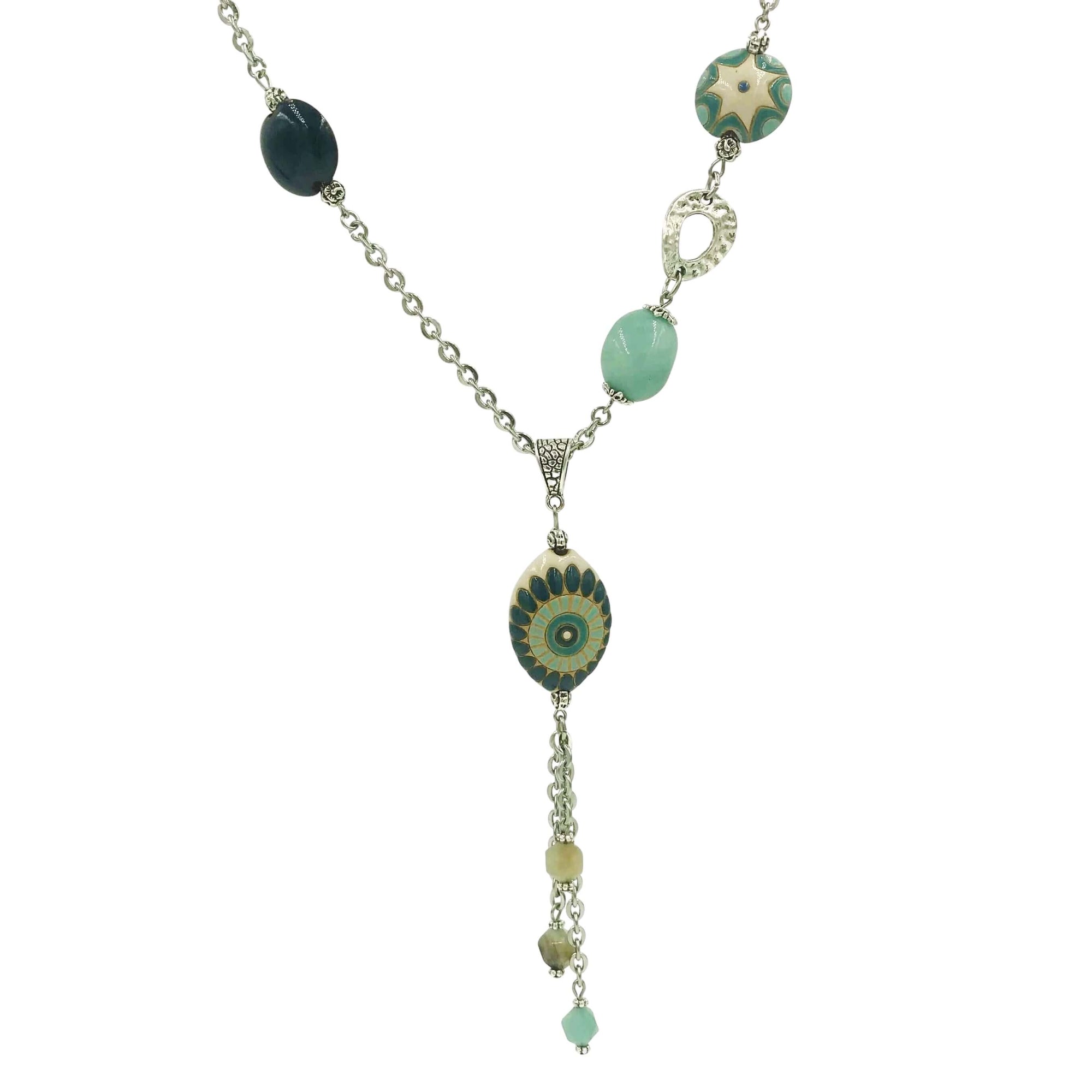 This silver pendant necklace was created using stainless steel chain, stones, pewter beads, and Golem clay beads.