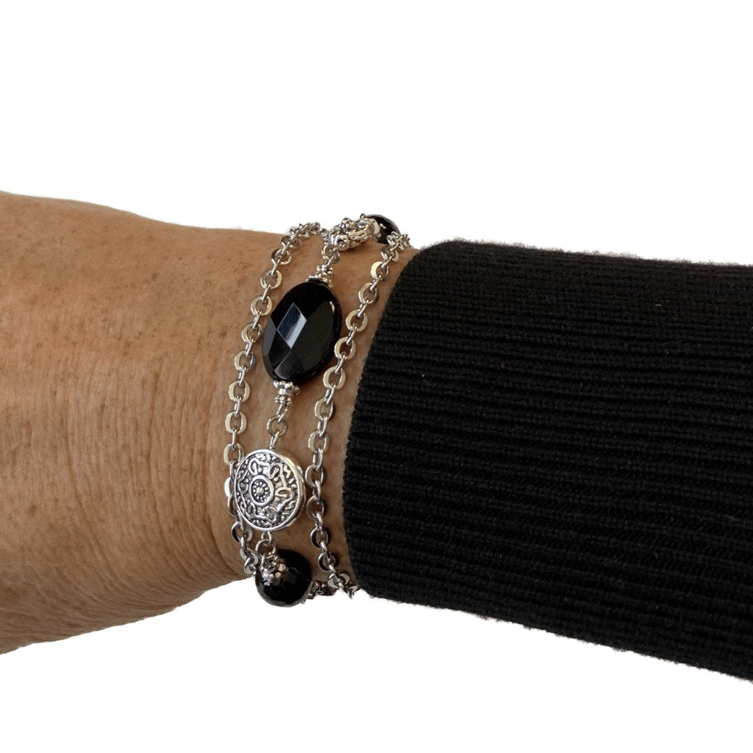 This is a photo of my arm and hand showing a silver chain bracelet and a silver beaded bracelet. I used stainless steel chain and a toggle clasp for one of the bracelets. You can find these in my Bracelets Collection at creativejewelrybymarcia.com